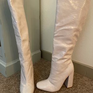 Knee-high snake skin boots
